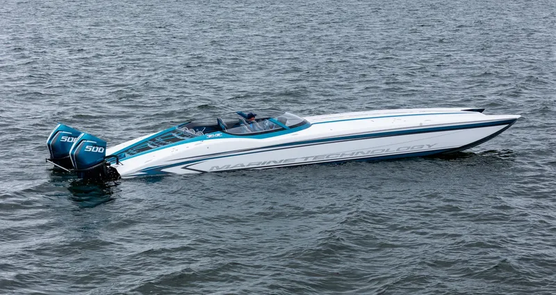 Slide: The Image of 2026 MTI 440X powerboat on water, featuring dual 500 engines. - 3