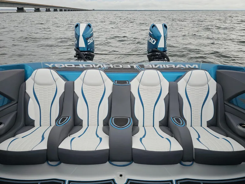 Slide: The Image of Luxury MTI 440X 2026 boat with stylish seating and powerful dual engines on open water. - 38