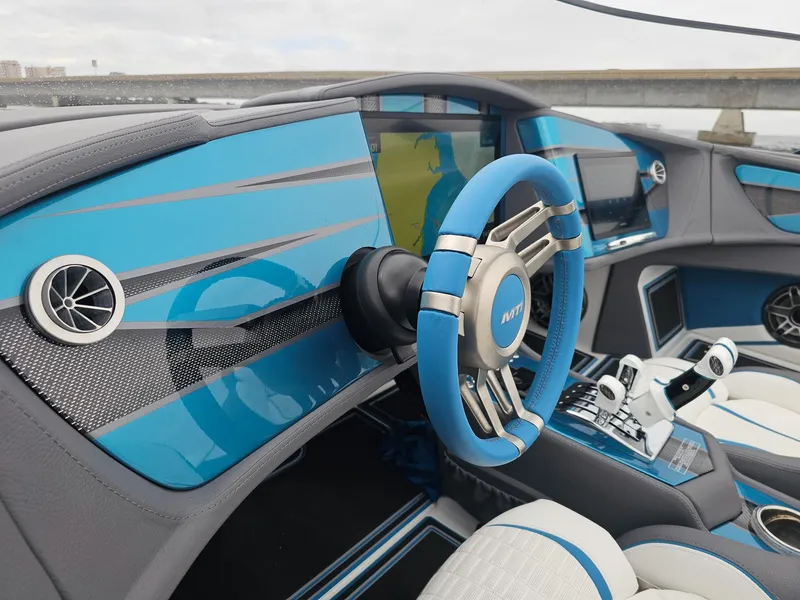 Slide: The Image of Futuristic MTI 440X 2026 boat interior with blue accents and advanced controls. - 39