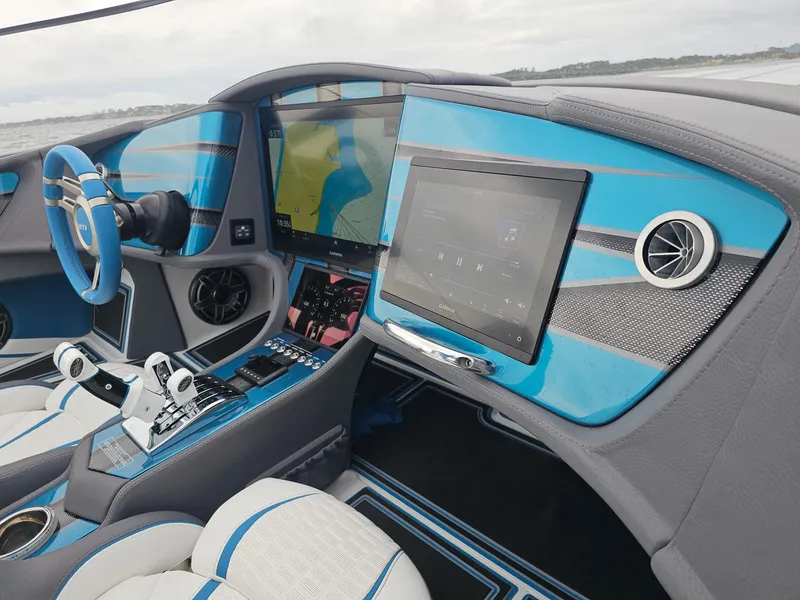 Slide: The Image of Interior of 2026 MTI 440X boat with blue accents and advanced navigation system. - 40
