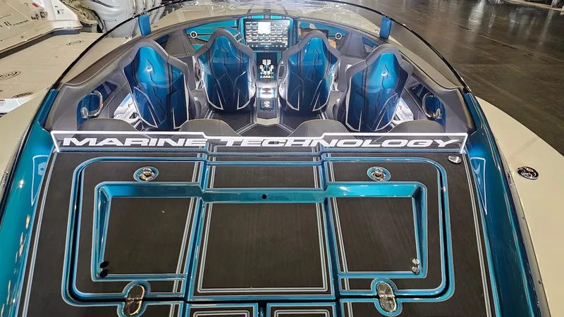 Slide: The Image of 2026 MTI 440X boat interior with blue seats and advanced dashboard. - 43