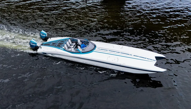 Slide: The Image of High-performance MTI 440X speedboat cruising on water, 2026 model, with dual outboard engines. - 49