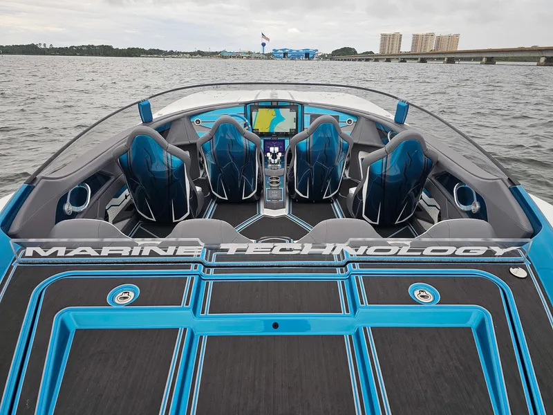 Slide: The Image of Luxury MTI 440X speedboat interior with advanced navigation, 2026 model, on open water. - 6