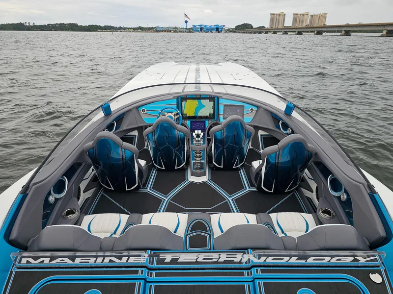 Slide: The Image of Luxury MTI 440X speedboat interior, 2026 model, featuring advanced navigation and stylish seating on open water. - 7