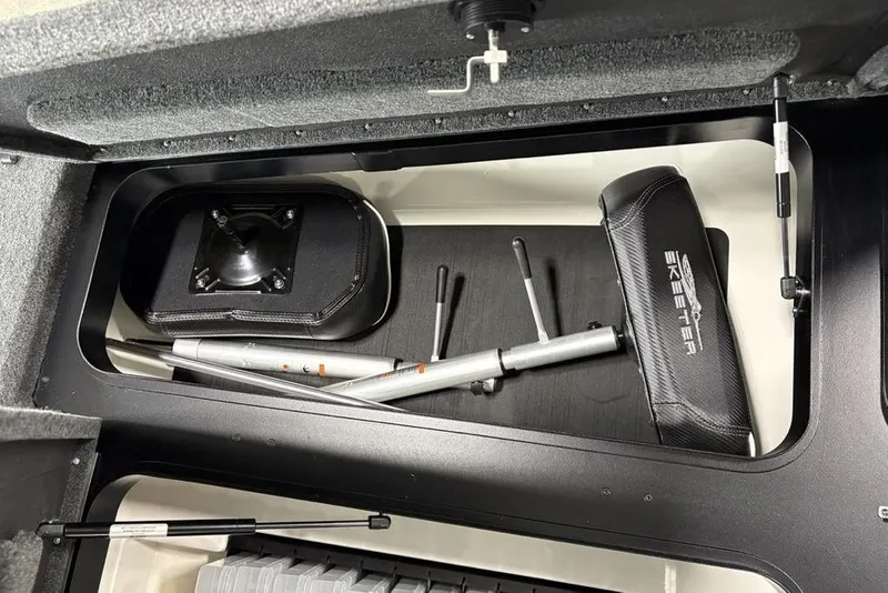 Slide: The Image of Storage compartment of 2025 Skeeter ZXR20 boat with equipment and accessories. - 12