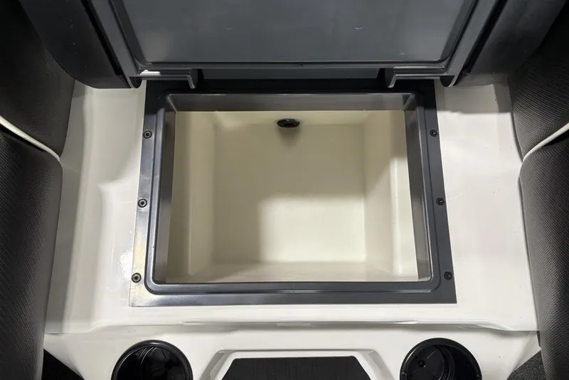 Slide: The Image of 2025 Skeeter ZXR20 boat storage compartment, open lid, spacious interior, white and gray design. - 15