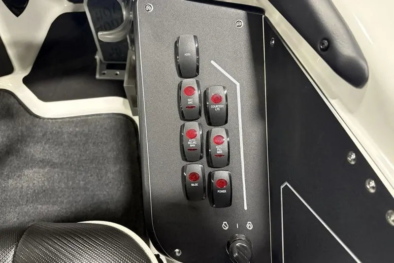 Slide: The Image of Control panel of 2025 Skeeter ZXR20 boat with labeled switches and buttons. - 21