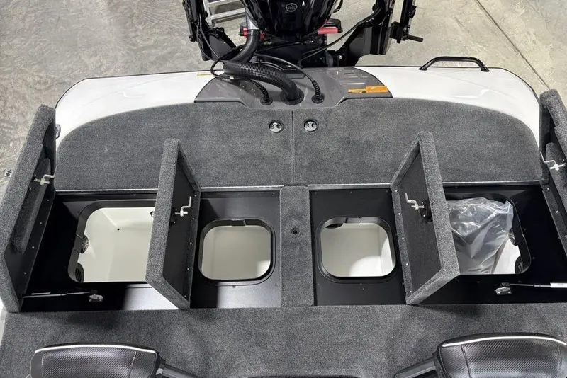 Slide: The Image of 2025 Skeeter ZXR20 boat storage compartments with open hatches, showcasing interior space. - 22