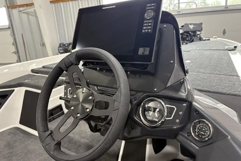 Slide: The Image of Steering console of 2025 Skeeter ZXR20 boat with advanced navigation display. - 23