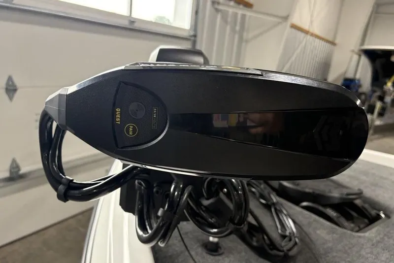 Slide: The Image of Close-up of a 2025 Skeeter ZXR20 boat component in a garage setting. - 3