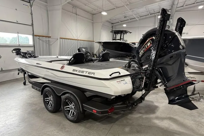 Slide: The Image of 2025 Skeeter ZXR20 boat in showroom, featuring sleek design and powerful engine. - 6