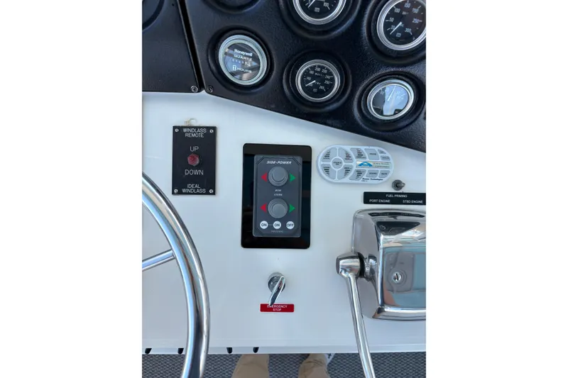Slide: The Image of Control panel of a 1987 Bertram 46.6 yacht with gauges and switches. - 24