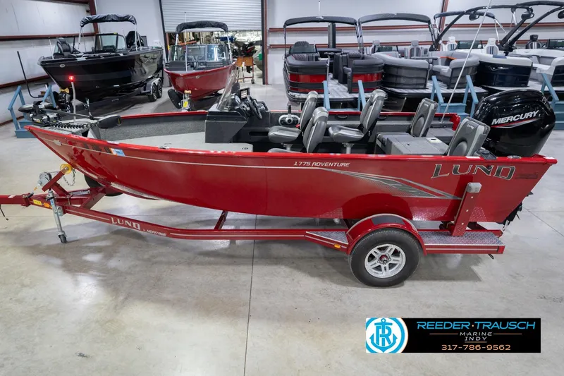 Slide: The Image of 2020 Lund 1775 Adventure SS boat in showroom, red color, with Mercury engine. - 1