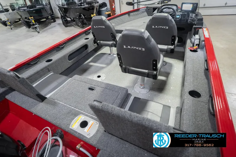 Slide: The Image of 2020 Lund 1775 Adventure SS boat interior with seating and control panel in showroom. - 12
