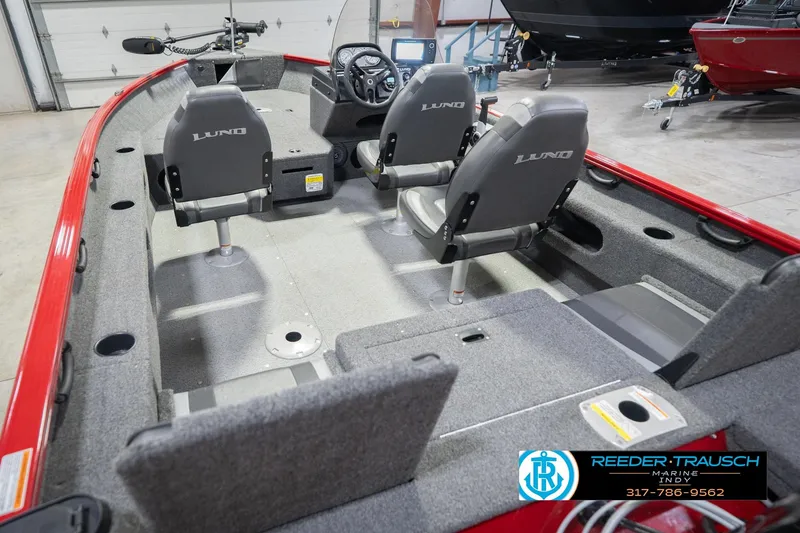 Slide: The Image of 2020 Lund 1775 Adventure SS boat interior with seating and steering console. - 13