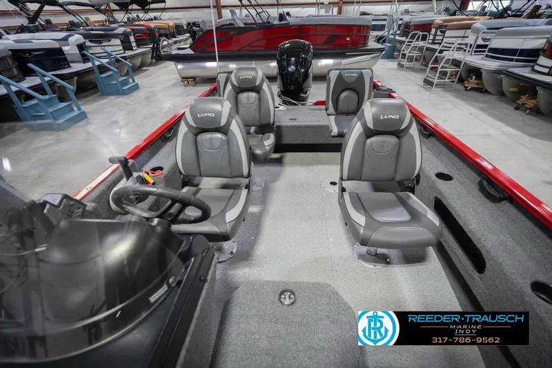 Slide: The Image of 2020 Lund 1775 Adventure SS boat interior with gray seating in showroom. - 18