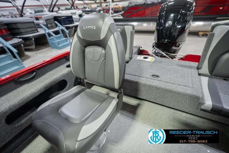 Slide: The Image of 2020 Lund 1775 Adventure SS boat interior with gray seating and motor, displayed at Reeder-Trausch Marine. - 20