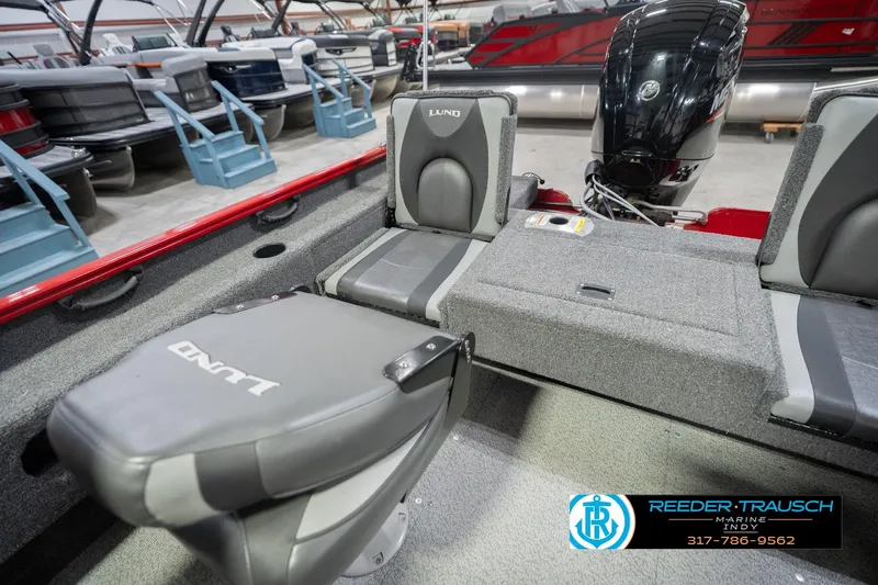 Slide: The Image of 2020 Lund 1775 Adventure SS boat interior with seating and motor, displayed at Reeder-Trausch Marine. - 21