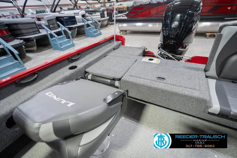 Slide: The Image of 2020 Lund 1775 Adventure SS boat interior with seating and motor, displayed at Reeder-Trausch Marine. - 22