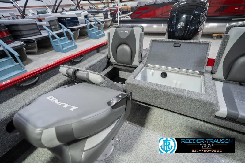 Slide: The Image of 2020 Lund 1775 Adventure SS boat interior with seating and storage compartments. - 23