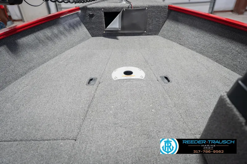 Slide: The Image of 2020 Lund 1775 Adventure SS boat interior with gray carpet and red trim. - 26