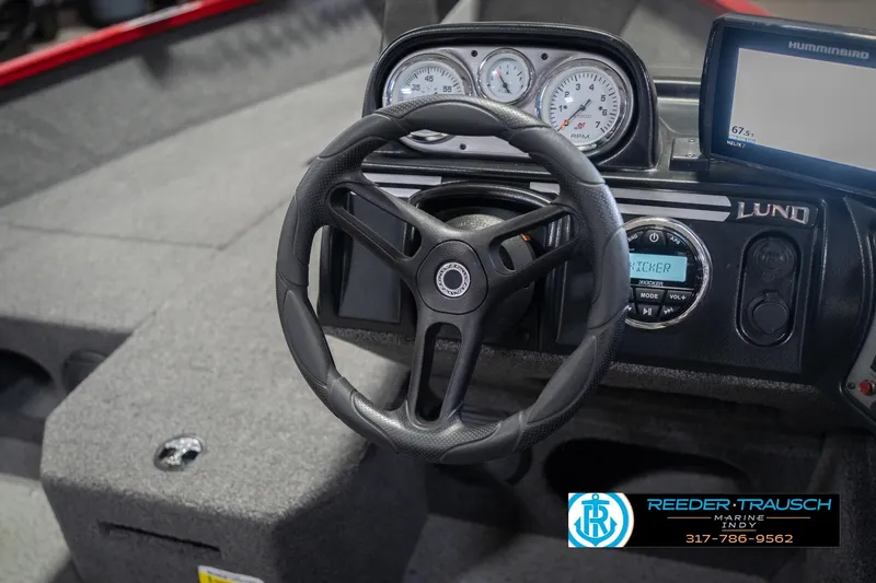 Slide: The Image of 2020 Lund 1775 Adventure SS boat dashboard with steering wheel and gauges. - 28