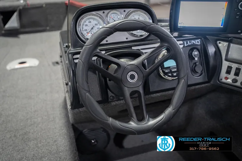 Slide: The Image of 2020 Lund 1775 Adventure SS boat dashboard with steering wheel and gauges. - 29