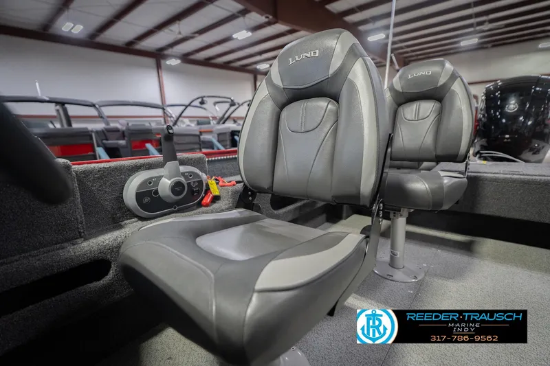 Slide: The Image of 2020 Lund 1775 Adventure SS boat interior with two gray seats in showroom. - 36