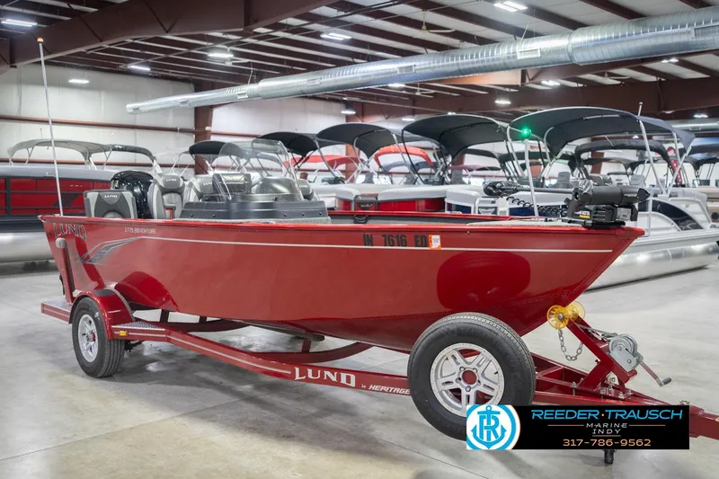 Slide: The Image of 2020 Lund 1775 Adventure SS boat in showroom, red color, on trailer. - 4
