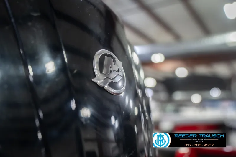 Slide: The Image of Close-up of a 2020 Lund 1775 Adventure SS boat emblem in a showroom. - 47