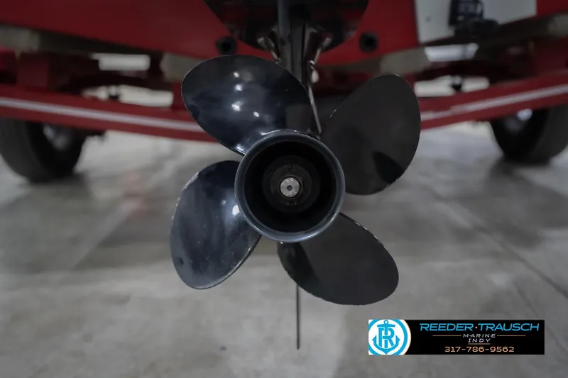 Slide: The Image of Close-up of a 2020 Lund 1775 Adventure SS boat propeller with red trailer background. - 48