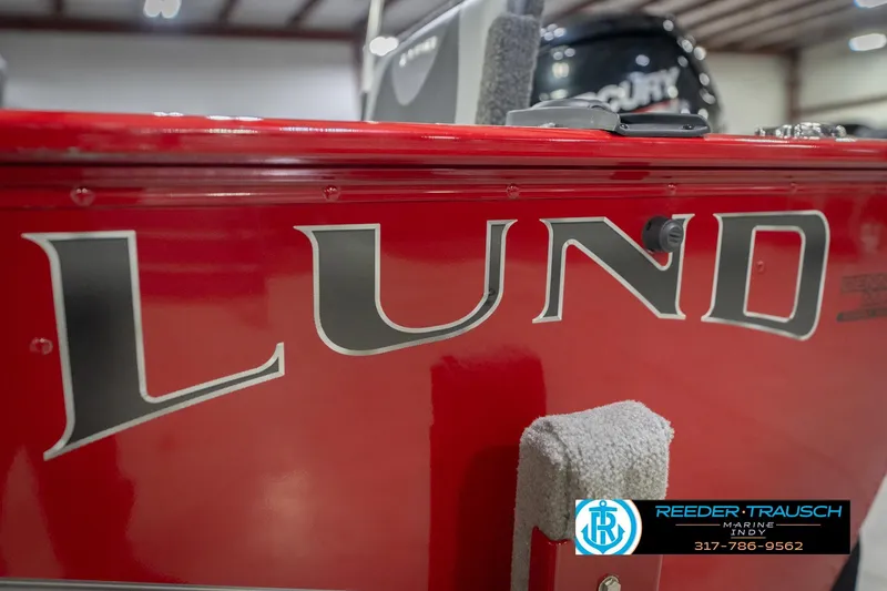 Slide: The Image of Red 2020 Lund 1775 Adventure SS boat with logo, indoor showroom display. - 53