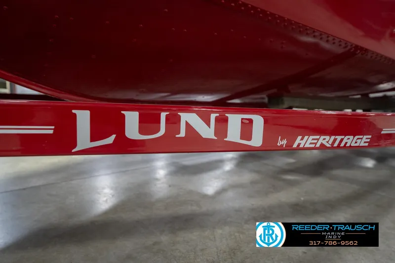 Slide: The Image of Red Lund 1775 Adventure SS boat trailer by Heritage, 2020 model, in showroom. - 57