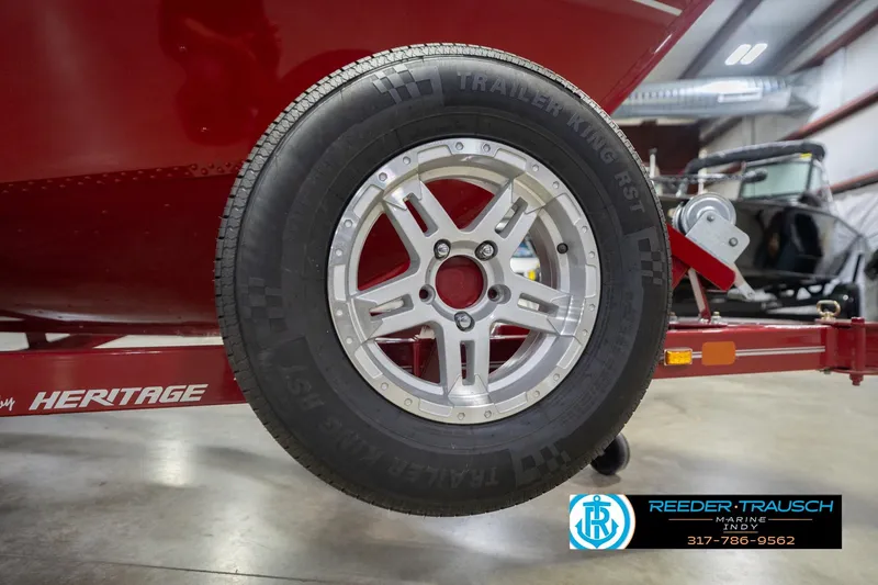 Slide: The Image of 2020 Lund 1775 Adventure SS trailer wheel, close-up view in a showroom setting. - 58