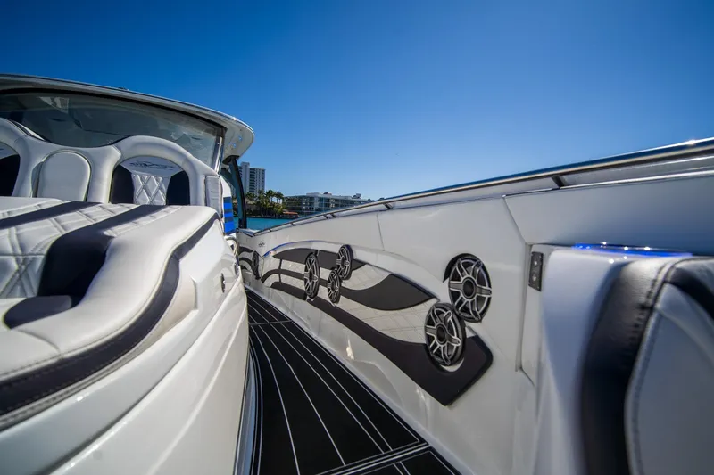 Slide: The Image of 2024 MTI V42 luxury boat interior with sleek seating and modern speaker system. - 18