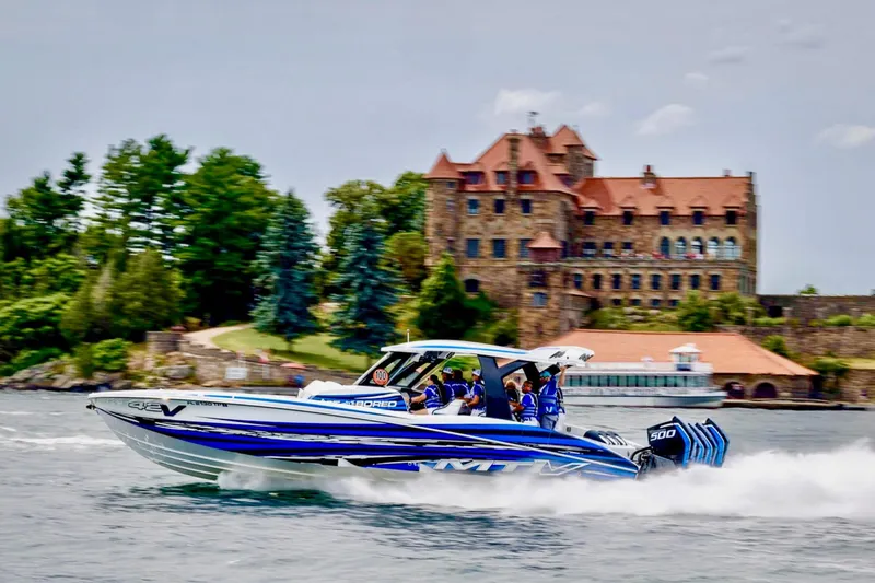 Slide: The Image of 2024 MTI V42 boat with multiple engines on clear blue water. - 3