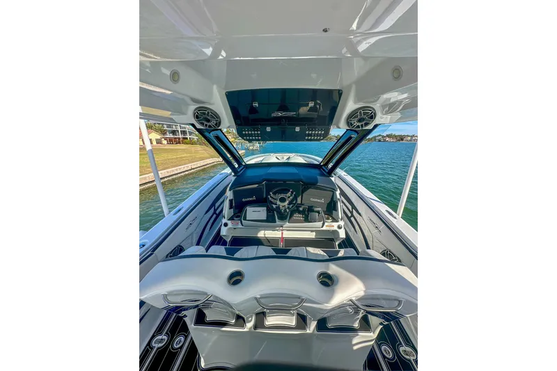 Slide: The Image of Cockpit view of 2024 MTI V42 boat with advanced navigation system and steering wheel. - 7
