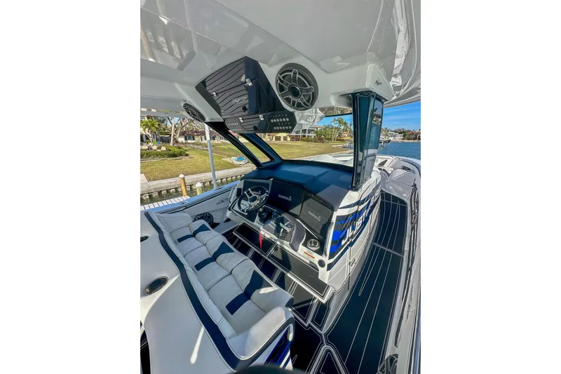 Slide: The Image of Interior of 2024 MTI V42 boat with modern dashboard and luxury seating. - 8