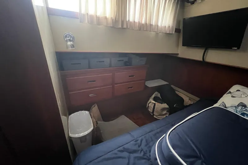 Slide: The Image of Cozy cabin interior of 1980 Grand Banks 42 Classic with storage and TV. - 14