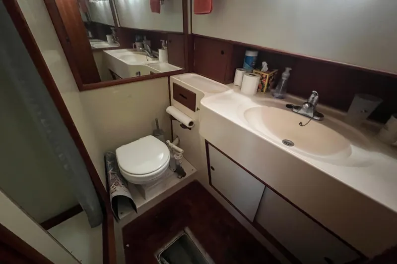 Slide: The Image of Bathroom interior of 1980 Grand Banks 42 Classic yacht, featuring sink and toilet. - 15