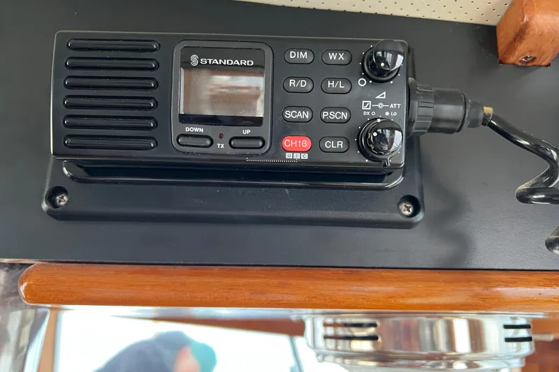 Slide: The Image of Marine radio equipment on a 1980 Grand Banks 42 Classic boat dashboard. - 18