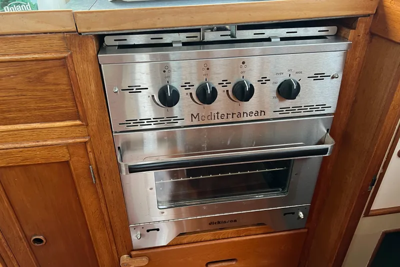 Slide: The Image of Stainless steel Mediterranean oven in 1980 Grand Banks 42 Classic yacht kitchen. - 20