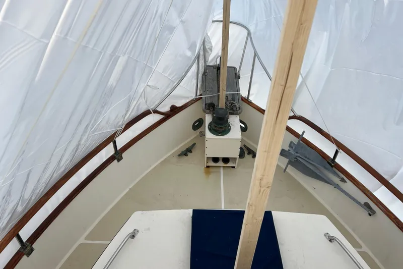 Slide: The Image of 1980 Grand Banks 42 Classic boat deck under protective cover. - 23