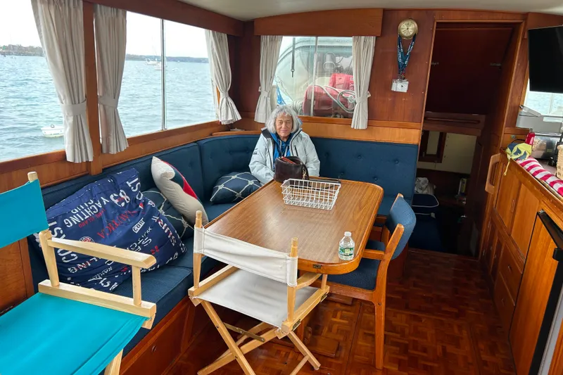 Slide: The Image of Interior of a 1980 Grand Banks 42 Classic yacht with a cozy dining area. - 3