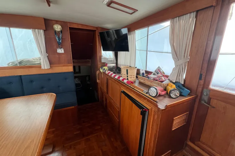 Slide: The Image of Interior of 1980 Grand Banks 42 Classic yacht with wooden furnishings and nautical decor. - 4