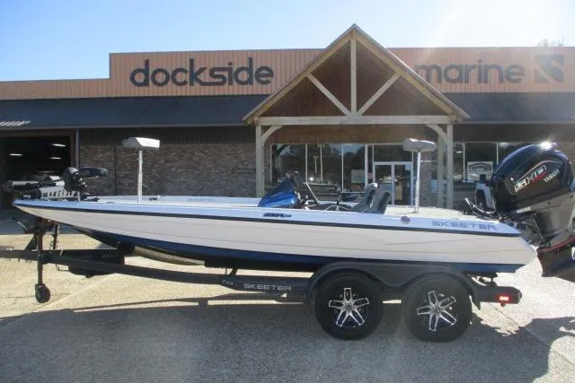 Slide: The Image of 2024 Skeeter ZXR19 boat displayed at Dockside Marine dealership. - 0