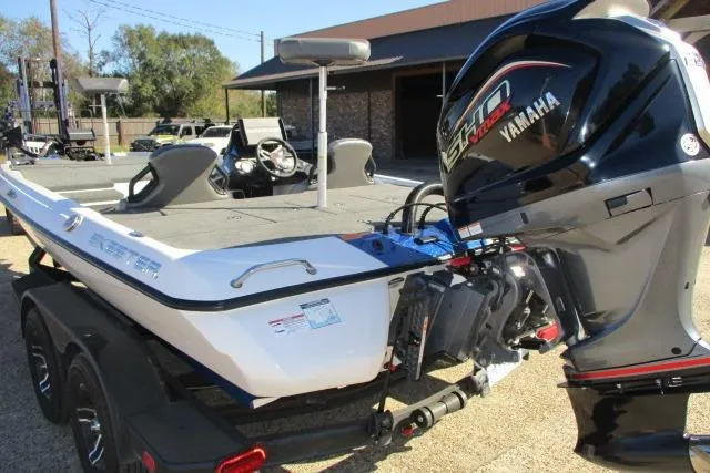 Slide: The Image of 2024 Skeeter ZXR19 boat with Yamaha engine, parked outdoors on a sunny day. - 8