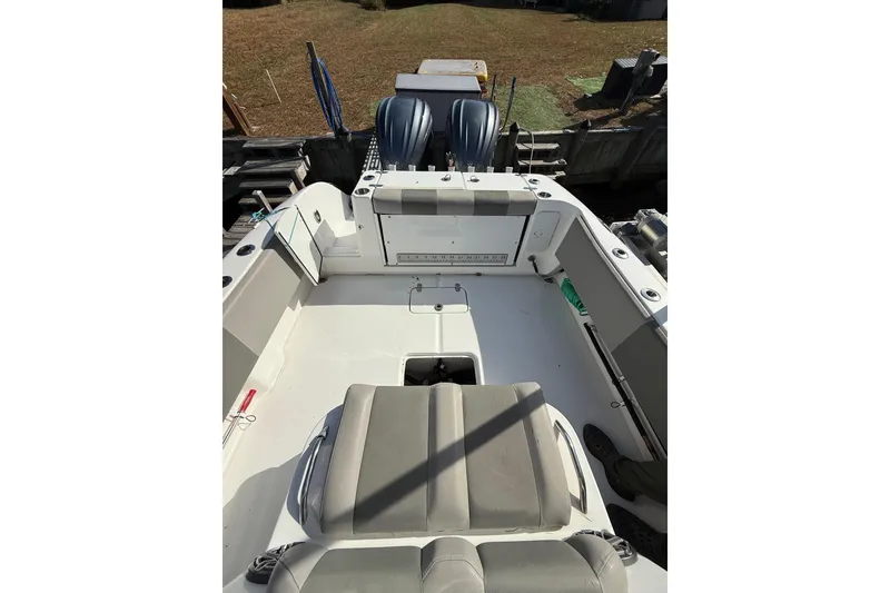 Slide: The Image of 2021 Cape Horn 32 XS boat interior with seating and dual outboard motors. - 6