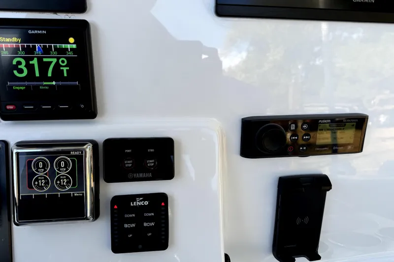 Slide: The Image of Control panel of 2021 Cape Horn 32 XS boat with Garmin and Fusion displays. - 8