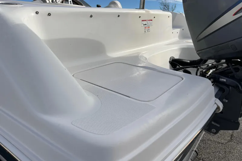 Slide: The Image of 2006 Hurricane FunDeck GS 194 OB boat with outboard motor, white deck view. - 17